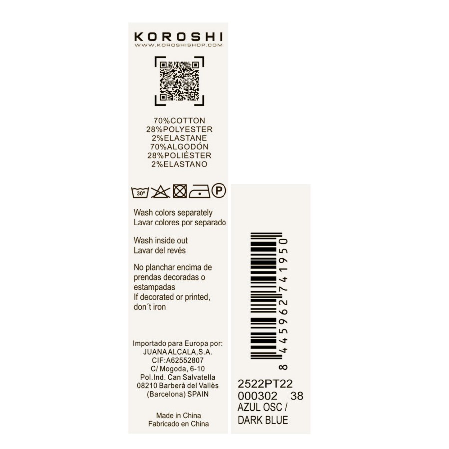 Pantalón slim de mujer en denim azul oscuro elástico, cinco bolsillos y placa metálica con logo Koröshi.