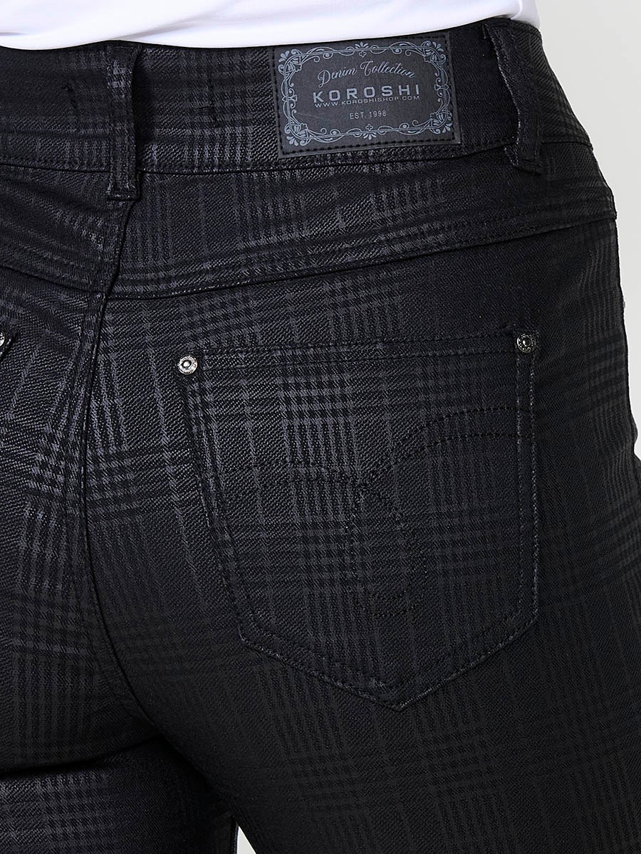 Women’s slim fit mid-rise pants in semi-shiny Glen plaid fabric, with five pockets and metal button closure.