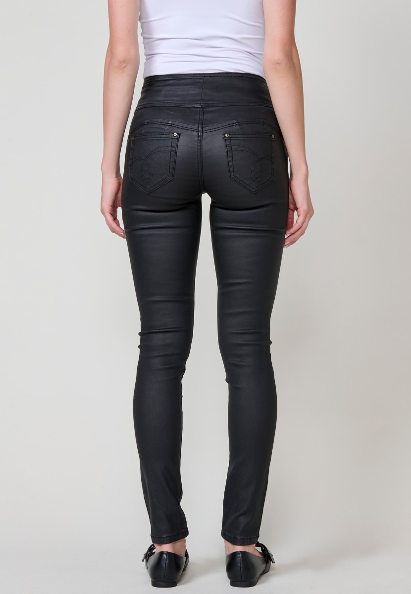 Women’s black high-waisted coated corset slim push up pants with five pockets, zip closure and three metallic buttons.