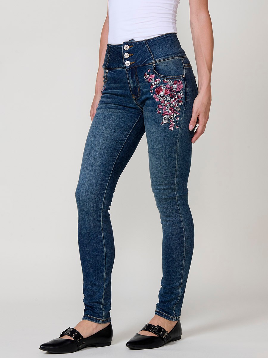 Jeans corset slim de mujer en denim azul oscuro elástico, tiro alto, cinco bolsillos y cierre con tres botones metálicos.