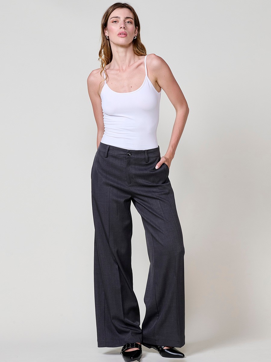 Women’s wide-leg high-rise pants with side pockets, belt loops, faux back welt pockets and Koröshi logo plate.