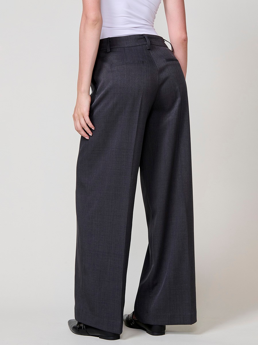 Women’s wide-leg high-rise pants with side pockets, belt loops, faux back welt pockets and Koröshi logo plate.