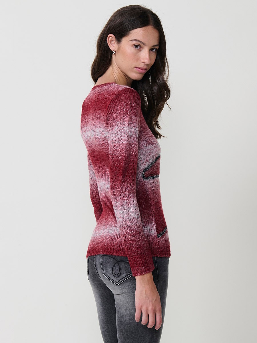 Jersey de punto para mujer con escote redondo, manga larga, detalles en hilo metalizado y lentejuelas. Placa metálica con logo Koröshi.