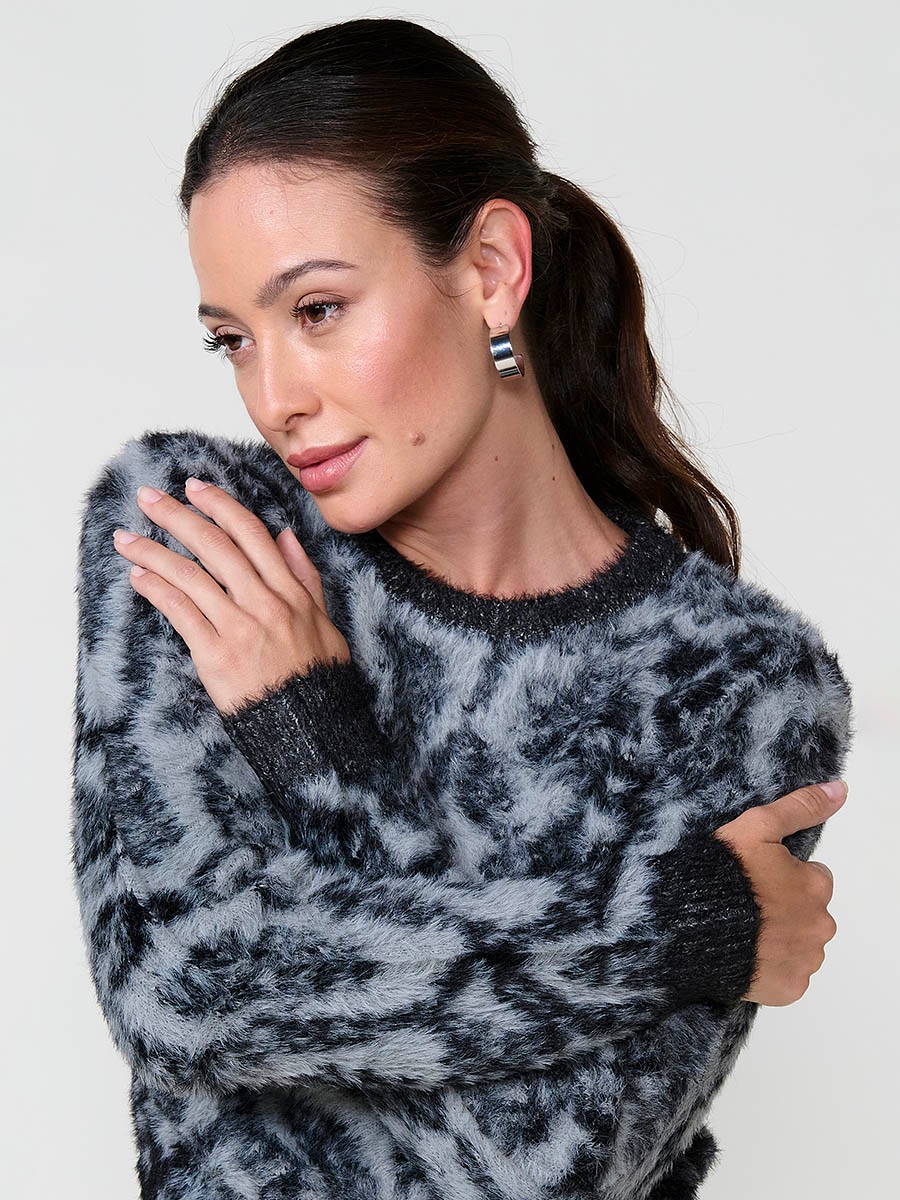 Women’s knit sweater with soft-touch furry texture, round neck, long sleeves, animal jacquard design and Koröshi metal logo plate.