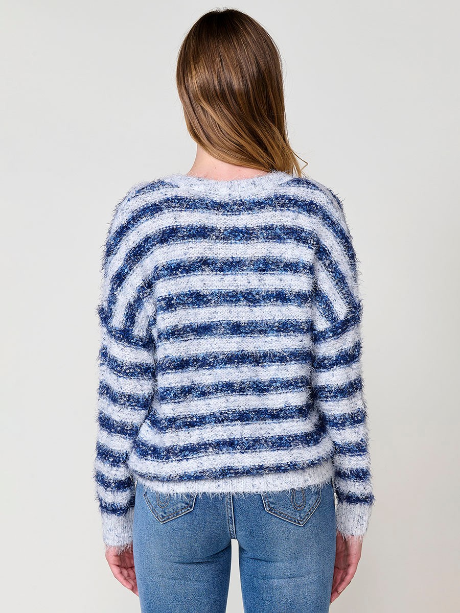 Women’s knit sweater with soft-touch furry texture, round neck, long sleeves, multicolor striped design and Koröshi logo plate.