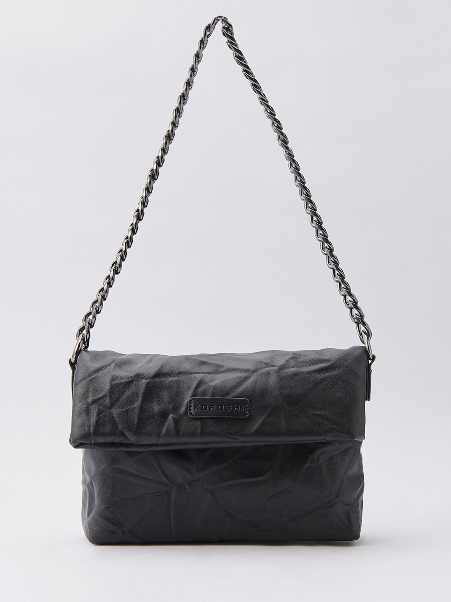 Women’s crossbody bag with wrinkled leather-effect texture, top zip closure and inner pocket.