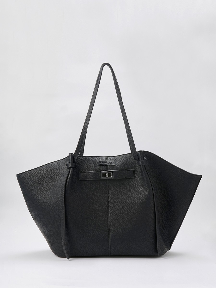 Large women’s shopper bag in faux leather with magnetic button closure and zip pouch inside.