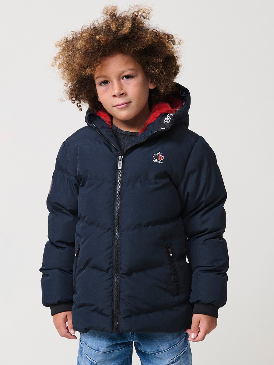 Blouson matelassé garçon en coloris navy avec capuche effet fourrure et fermeture zippée. Chaud et confortable.