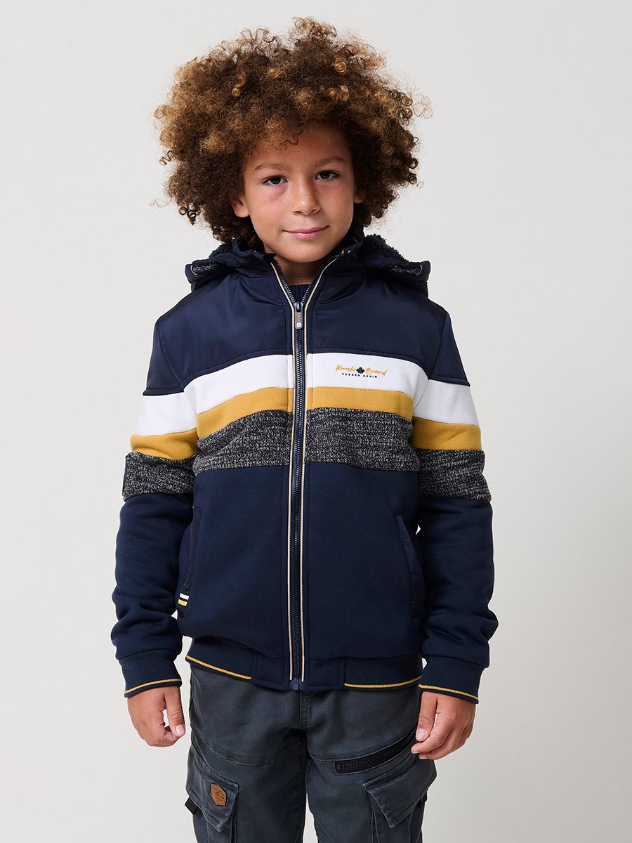 Veste garçon navy en molleton de coton et polyester, doublée et avec capuche amovible.