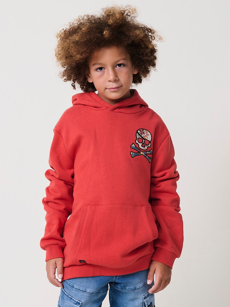 Sudadera de niño en felpa de algodón perchada en color teja, con capucha y bolsillo canguro. Cálida y cómoda.