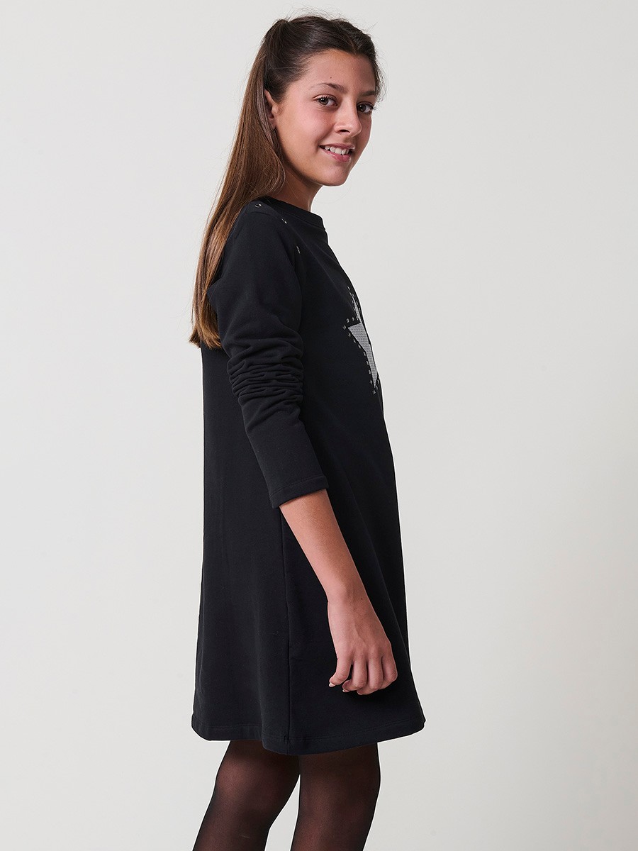 Robe fille noire en coton élastique, manches longues, col rond côtelé et motif étoile argentée avec clous décoratifs.